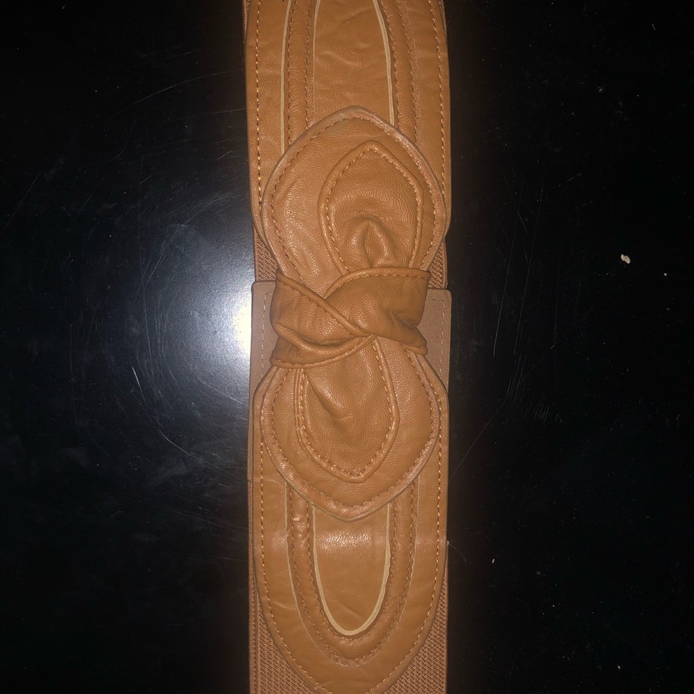 brown elastic bow belt and neon orange belt
